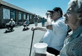 Elderly Couple drinking cups of tea on the English Seaside