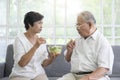 An elderly couple are eating healthy food , grandparents health care concept Royalty Free Stock Photo