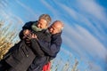 Elderly couple embracing and celebrating the sun Royalty Free Stock Photo