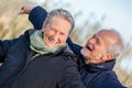 Elderly couple embracing and celebrating the sun Royalty Free Stock Photo