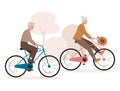 Elderly couple enjoying cycling. Smiling grandfather and grandmother riding bicycle in the park. Walking, sports, traveling