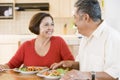 Elderly Couple Enjoying meal,mealtime Together Royalty Free Stock Photo