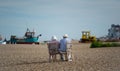 Elderly couple enjoying the view on Aldeburgh beach