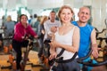 Elderly couple exercising in gym Royalty Free Stock Photo