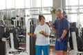 Elderly couple exercising at gym. Royalty Free Stock Photo