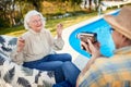 Elderly couple have fun at holiday and captures with a camera Royalty Free Stock Photo