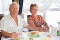 Elderly couple having breakfast at restaurant Royalty Free Stock Photo