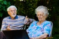 Elderly couple having fun with the laptop outdoors Royalty Free Stock Photo