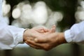 Elderly couple holding hands in autumn park close-up Royalty Free Stock Photo