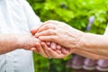 Elderly couple holding hands Royalty Free Stock Photo