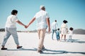 Elderly couple, holding hands and family at beach with back for walk, freedom and vacation together with love. Old man Royalty Free Stock Photo