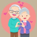 Elderly couple holding hands make shape of heart