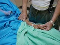 Elderly couple holding hands on a patient bed Royalty Free Stock Photo