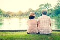 An old married couple sitting in a happy garden Royalty Free Stock Photo