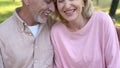 Elderly couple laughing together, enjoying romantic date, mutual understanding Royalty Free Stock Photo