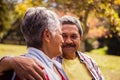 Elderly couple looking at each other while sitting on a bench Royalty Free Stock Photo