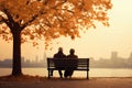 an elderly couple, a man and a woman, are sitting on a bench and enjoying the scenery, beautiful landscape at sunset, rear Royalty Free Stock Photo