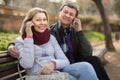 Elderly couple with mobile phones Royalty Free Stock Photo