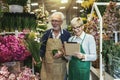 Senior couple in own flower shop. Concept of small business Royalty Free Stock Photo