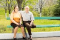 Elderly couple on a park bench Royalty Free Stock Photo