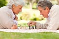 Elderly couple playing chess Royalty Free Stock Photo