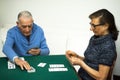 Elderly couple playing a game of cards Royalty Free Stock Photo