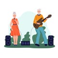 An elderly couple plays guitar and sings