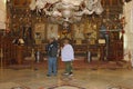 Elderly couple praying bible interior holy Nativity church, Bethlehem