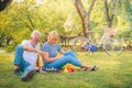 Elderly couple enjoying in garden at sunset. Concept couple elder love Royalty Free Stock Photo