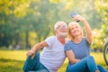 Elderly couple enjoying in garden at sunset. Concept couple elder love Royalty Free Stock Photo