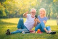 Elderly couple enjoying in garden at sunset. Concept couple elder love Royalty Free Stock Photo