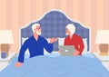Elderly couple relaxing in bed having a conversation