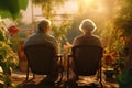 Elderly couple relaxing together in a urban green area. Urban garden or balcony concept. Happy retirement Royalty Free Stock Photo