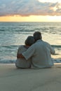 Elderly couple rest at tropical beach Royalty Free Stock Photo