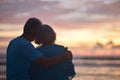 Elderly couple rest at tropical beach Royalty Free Stock Photo