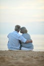 Elderly couple rest at tropical beach Royalty Free Stock Photo