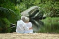 Elderly couple rest at tropical resort Royalty Free Stock Photo