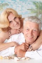 Elderly couple with seashells