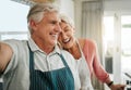 Elderly, couple and selfie in home happy while cooking, baking or cleaning together in funny moment. Older man, woman Royalty Free Stock Photo