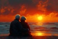 an elderly couple is sitting on the beach watching the sunset