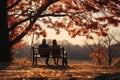Elderly couple sitting and hugging on a park bench in autumn park Royalty Free Stock Photo