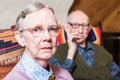 Elderly Couple Sitting in Livingroom Royalty Free Stock Photo