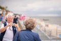 Elderly couple taking pictures on holidays