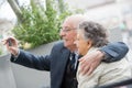 Elderly couple taking selfie with smartphone Royalty Free Stock Photo