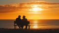 Elderly Couple Together Enjoying Sunset on Beach Bench