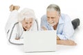 Elderly couple using laptop