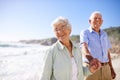 Elderly, couple and walk on beach for portrait on retirement vacation or anniversary to relax with love, care and Royalty Free Stock Photo