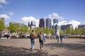 Elderly couple walk on Plein in The hague on spring day