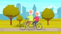 Elderly couple walking in city park and riding pair bike together. Adult people on funny walk