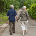 Elderly couple walking hand in hand Royalty Free Stock Photo